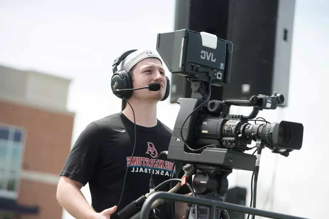 JDM student filming football game for TV-20