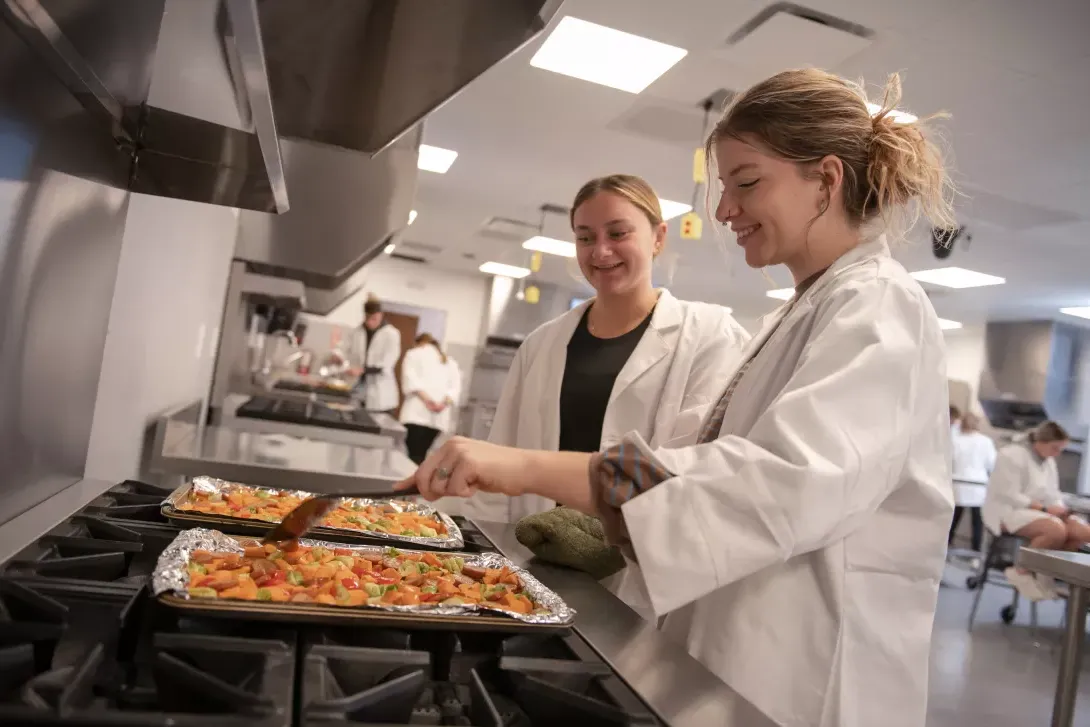 students cooking in dietetics food lab